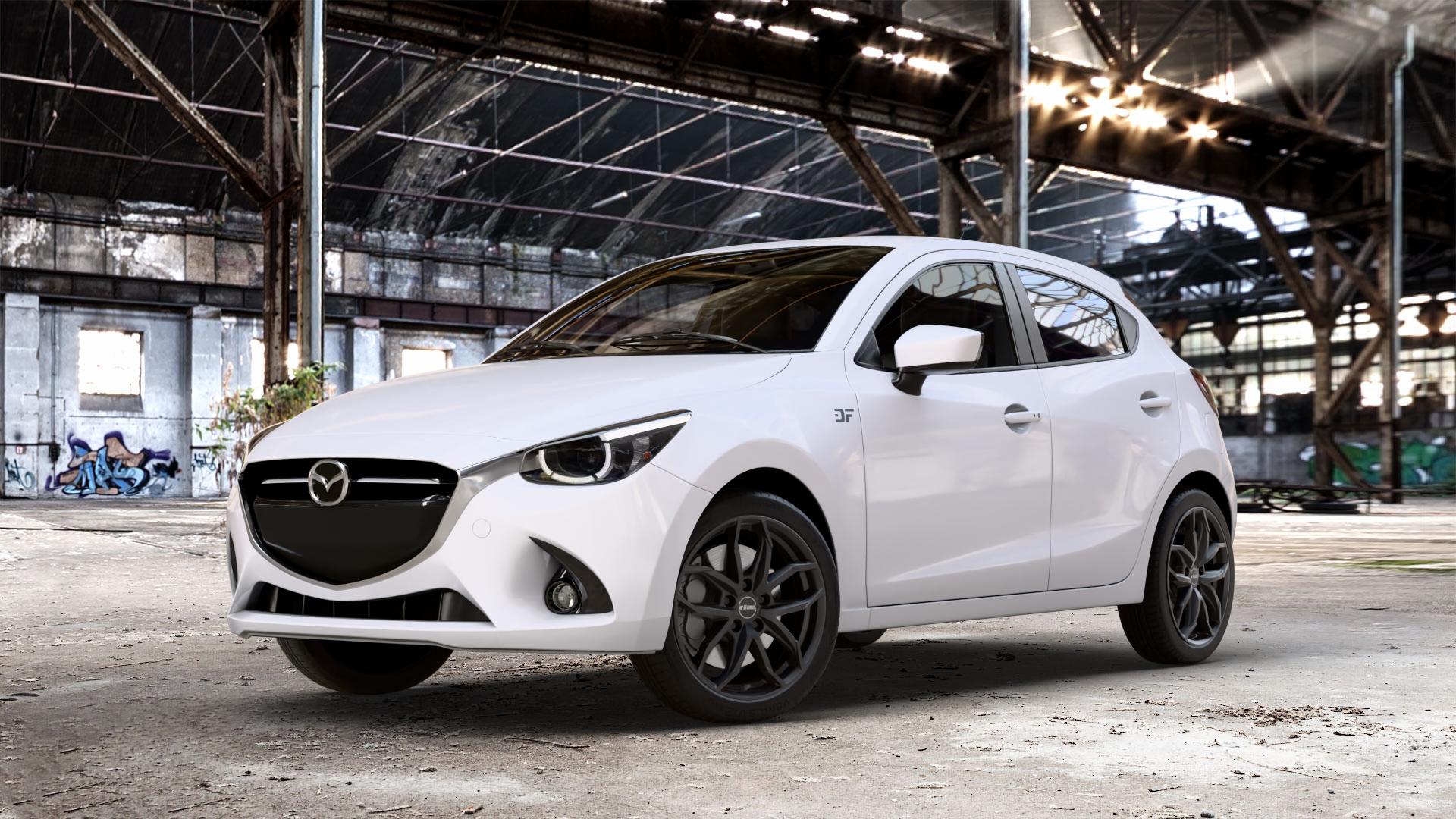 RIAL Lucca diamant-schwarz Felge mit Reifen in 17Zoll Winterfelge Alufelge auf weissem Mazda 2 (15-) (DJ) 1,5l SKYACTIV-G 75 55kW (75 PS) 90 66kW (90 115 85kW (116 SKYACTIV-D 105 77kW (105 (20-) Facelift ⬇️ mit 15mm Tieferlegung ⬇️ Old Industrial Hall_max_4400mm_2024 Frontansicht_1