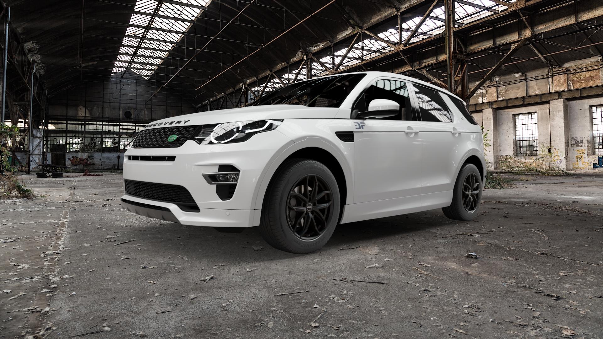 RIAL Lucca diamant-schwarz Felge mit Reifen in 18Zoll Winterfelge Alufelge auf weissem Land Rover Discovery Sport Typ LC Facelift ⬇️ mit 15mm Tieferlegung ⬇️ Old Industrial Hall_max5000mm_2022 Frontansicht_1