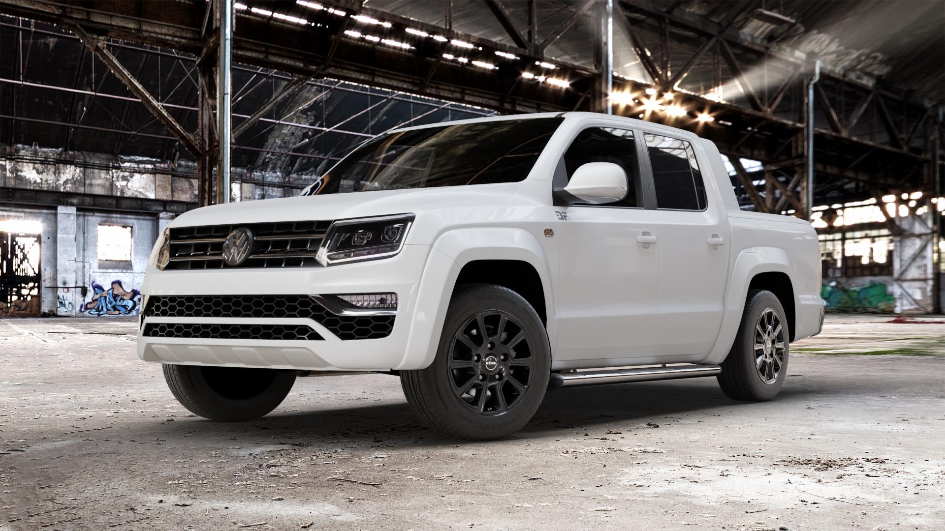RIAL Transporter 2 diamant-schwarz Felge mit Reifen in 18Zoll Winterfelge Alufelge auf weissem Volkswagen (VW) Amarok I Typ 2H Facelift ⬇️ mit 15mm Tieferlegung ⬇️ Old Industrial Hall_max_5300mm_2024 Frontansicht_1