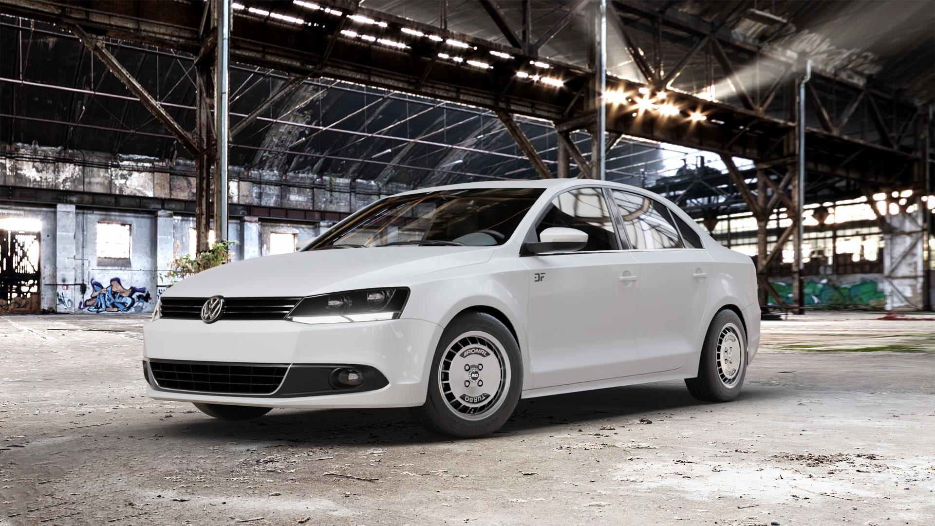 RONAL R10 TURBO SCHWARZ FRONTKOPIERT Felge mit Reifen silber in 15Zoll Winterfelge Alufelge auf weissem Volkswagen (VW) Jetta 6 Typ 16 Facelift ⬇️ mit 15mm Tieferlegung ⬇️ Old Industrial Hall_max_5300mm_2024 Frontansicht_1