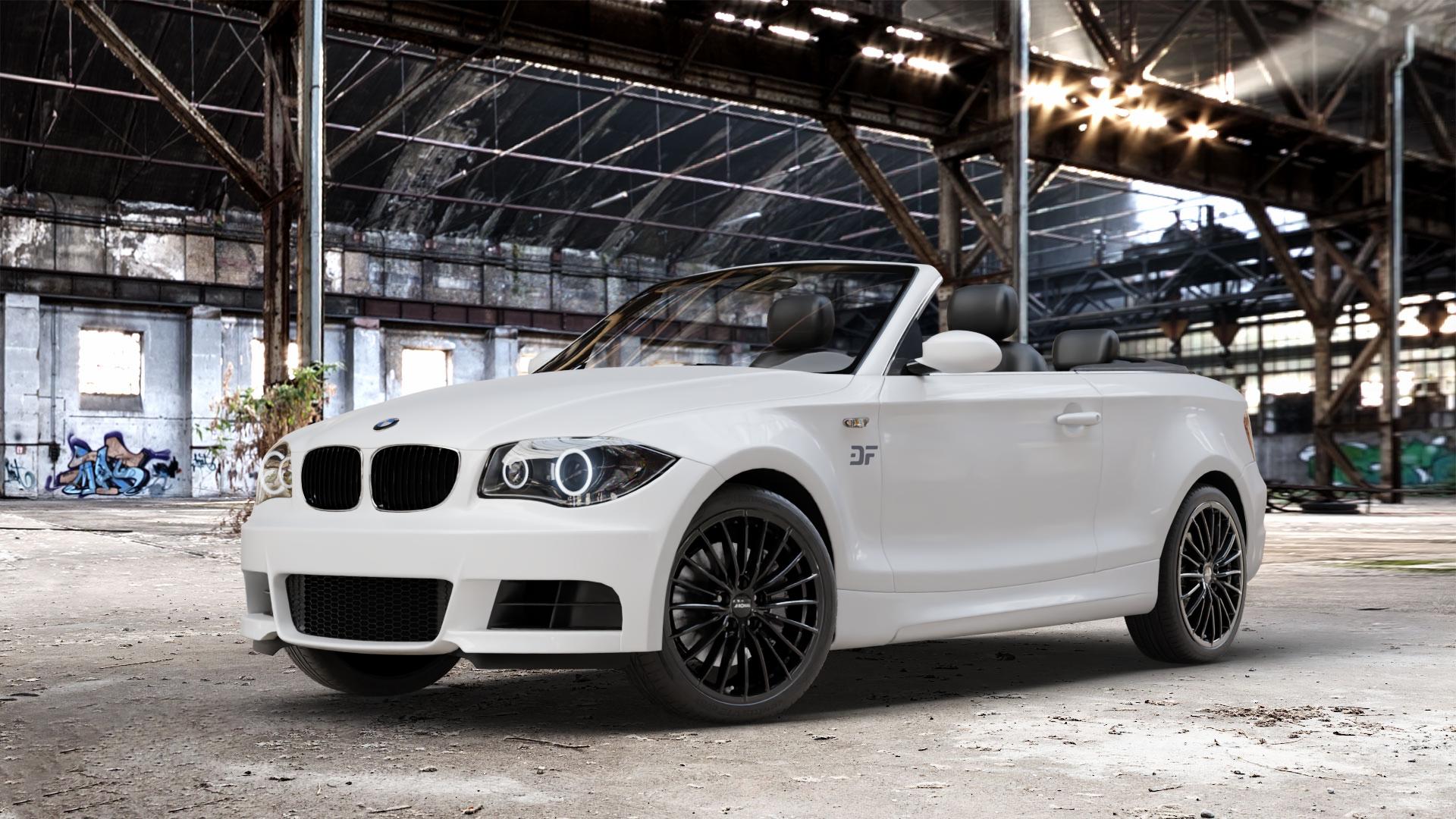 RONAL R68 JETBLACK Felge mit Reifen schwarz in 18Zoll Winterfelge Alufelge auf weissem BMW 118i Typ E88 (Cabriolet) 120d 120i 125i 135i 123d 118d 1er Cabrio (182, 1C) ⬇️ mit 15mm Tieferlegung ⬇️ Old Industrial Hall_max_4400mm_2024 Frontansicht_1