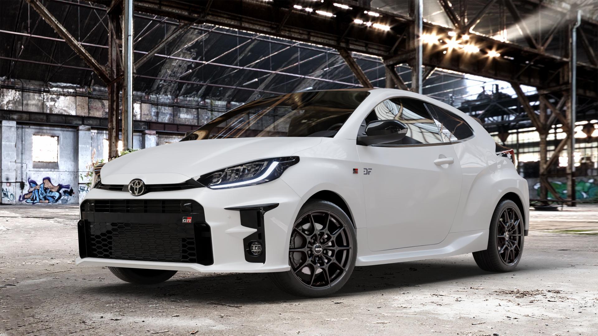 SPARCO FF2 MATT BLACK Felge mit Reifen schwarz in 18Zoll Winterfelge Alufelge auf weissem Toyota Yaris IV Typ XPA1F(EU,M) l kW (0 PS) GR XPA1G(EU,M) ⬇️ mit 15mm Tieferlegung ⬇️ Old Industrial Hall_max_4400mm_2024 Frontansicht_1