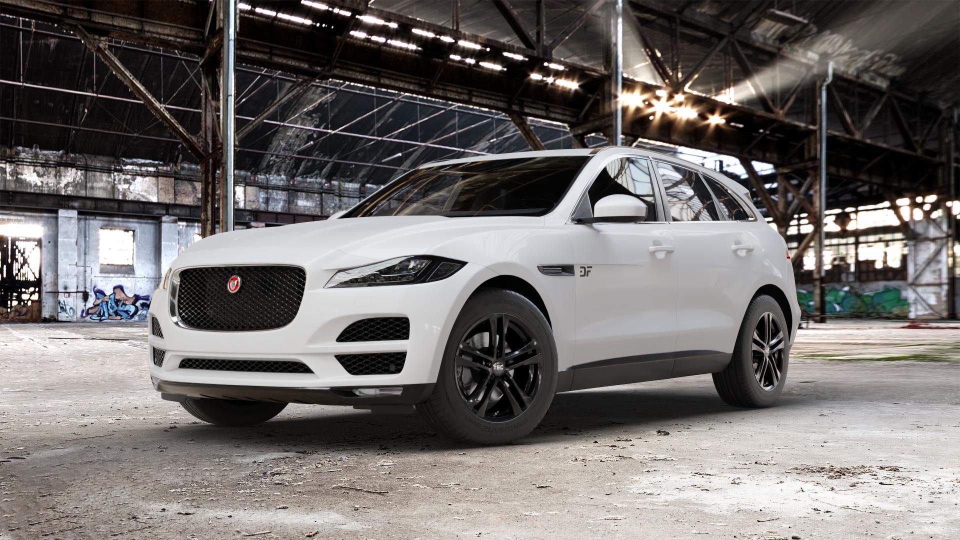 Tec Speedwheels AS4 Schwarz Glanz Felge mit Reifen in 18Zoll Winterfelge Alufelge auf weissem Jaguar F-Pace Typ DC ⬇️ mit 15mm Tieferlegung ⬇️ Old Industrial Hall_max_5300mm_2024 Frontansicht_1