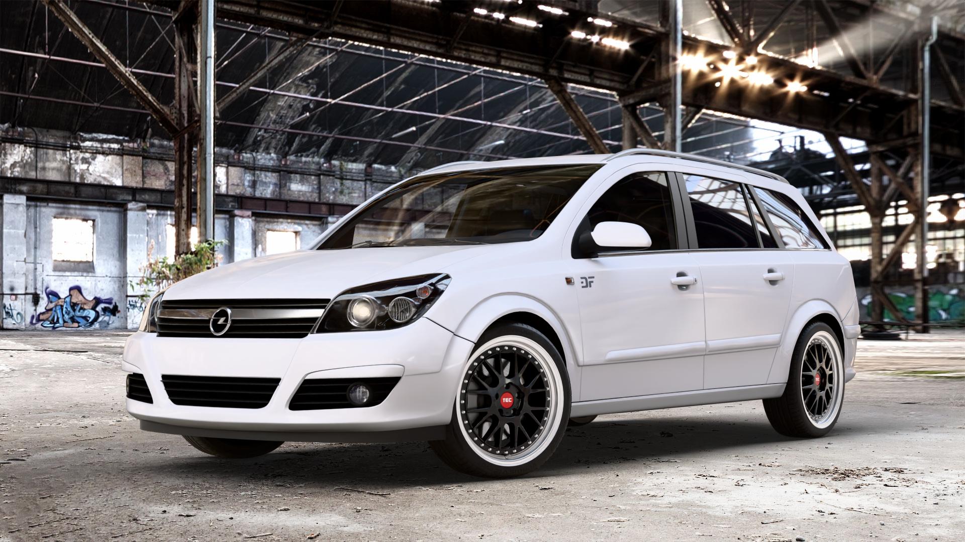 Tec Speedwheels GT EVO Schwarz Glanz Hornpoliert Felge mit Reifen silber mehrfarbig in 18Zoll Alufelge auf weissem Opel Astra H Typ A-H Caravan A-H/SW ⬇️ mit 15mm Tieferlegung ⬇️ Old Industrial Hall_max_4400mm_2024 Frontansicht_1