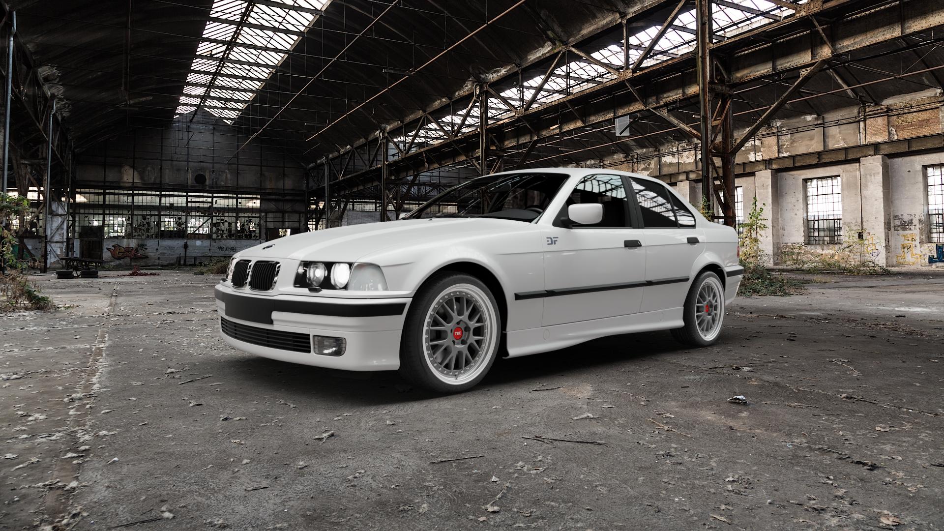 Tec Speedwheels GT EVO Titan Glanz Hornpoliert Felge mit Reifen grau silber mehrfarbig in 18Zoll Alufelge auf weissem BMW 318is Typ E36 (Limousine) 316i 318i 320i 323i 325i 328i 325td 325tds 318tds 3er Limousine (3C, 3/C) ⬇️ mit 15mm Tieferlegung ⬇️ Old Industrial Hall_max5000mm_2022 Frontansicht_1