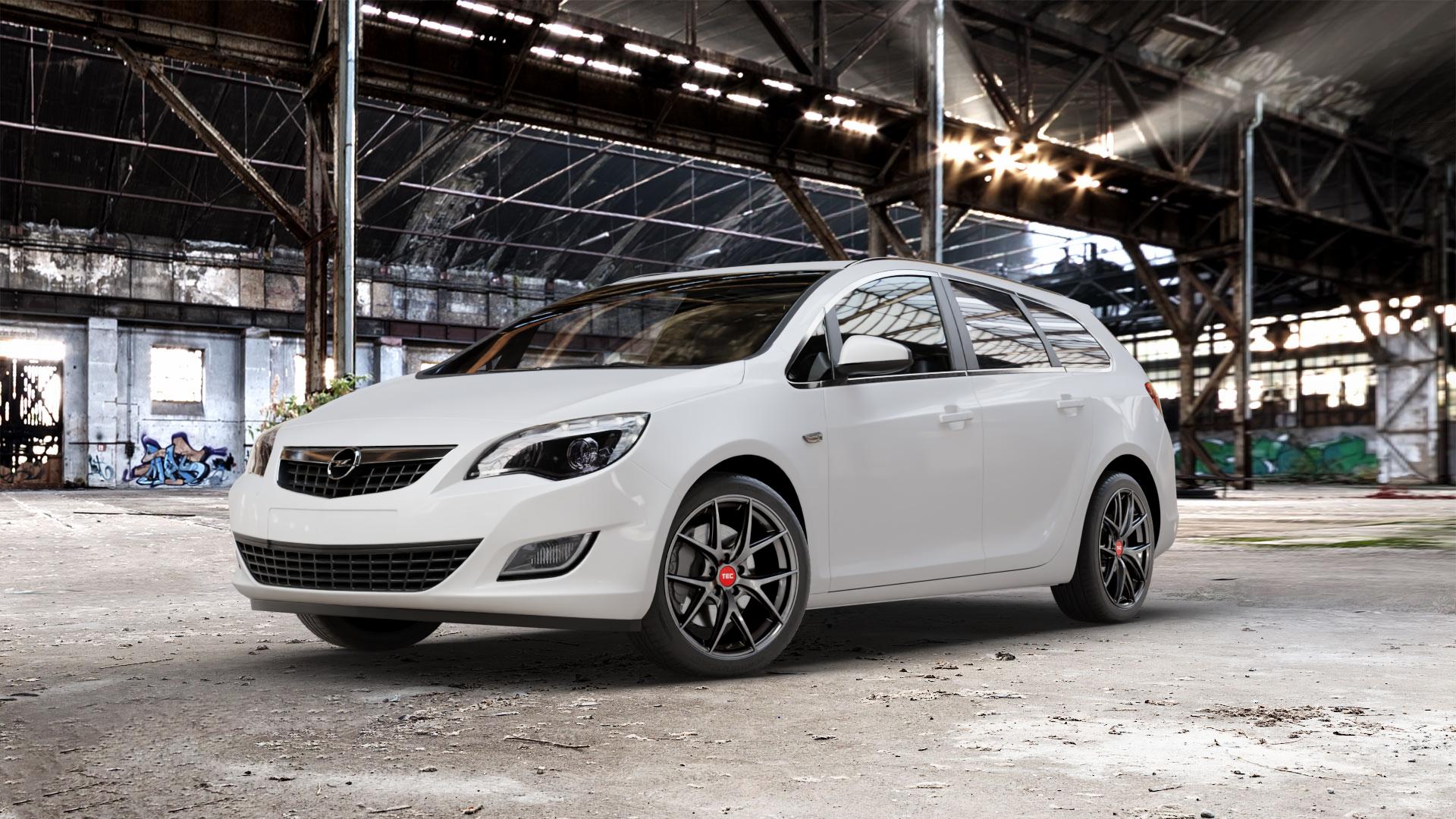 Tec Speedwheels GT6 EVO Hyper Black Felge mit Reifen grau schwarz anthrazit in 18Zoll Winterfelge Alufelge auf weissem Opel Astra J Sports Tourer Typ P-J/SW Facelift ⬇️ mit 15mm Tieferlegung ⬇️ Old Industrial Hall_max_5300mm_2024 Frontansicht_1