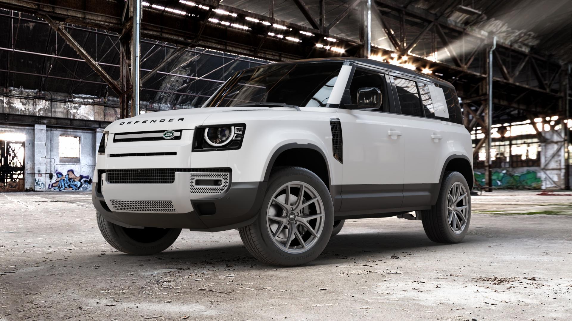Tec Speedwheels GT6 EVO Hyper Black Felge mit Reifen grau schwarz anthrazit in 20Zoll Winterfelge Alufelge auf weissem Land Rover Defender 110 Typ LE ⬇️ mit 15mm Tieferlegung ⬇️ Old Industrial Hall_max_5300mm_2024 Frontansicht_1