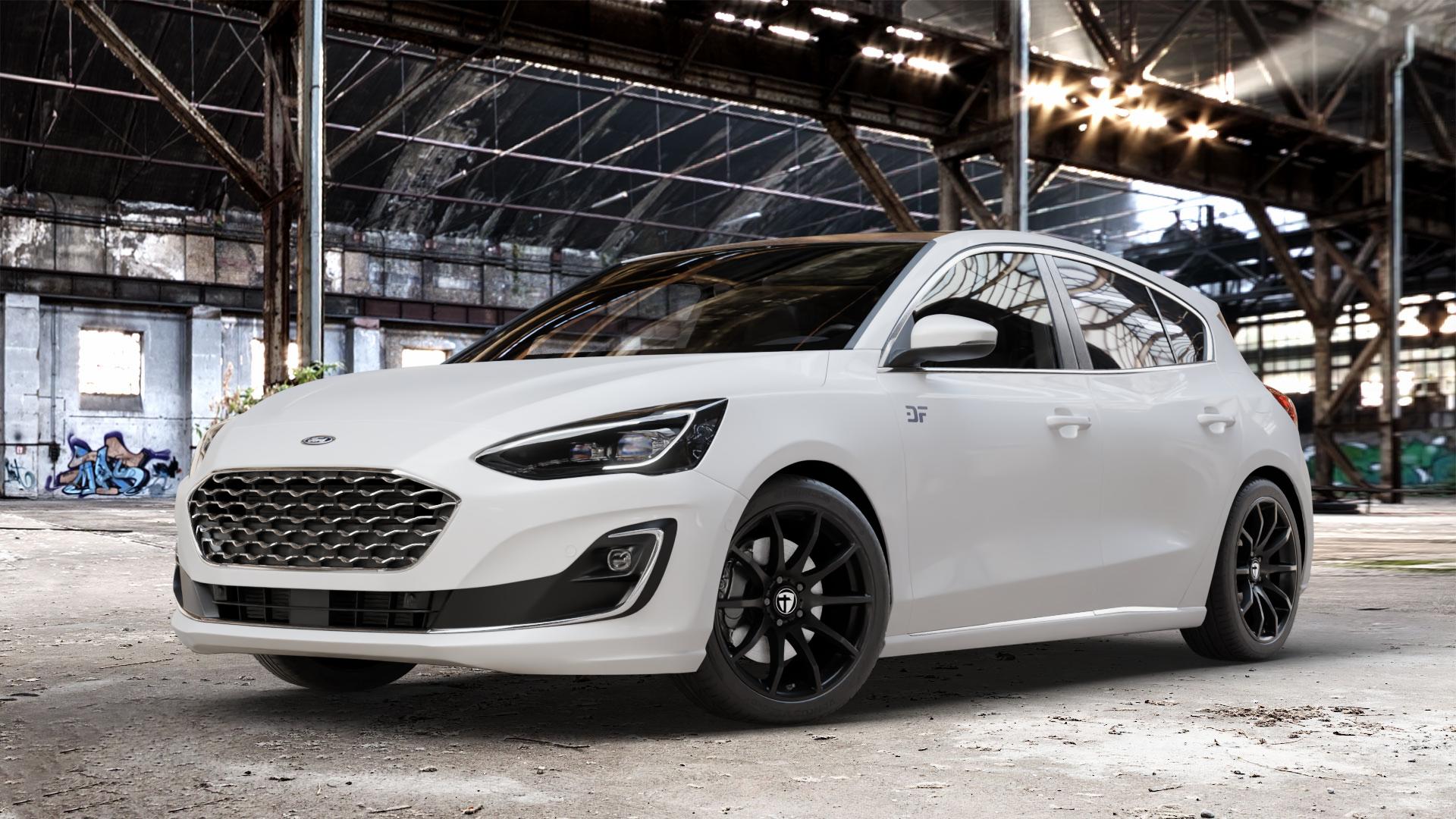 TOMASON TN1 black painted Felge mit Reifen schwarz in 18Zoll Winterfelge Alufelge auf weissem Ford Focus IV Typ DEH (Schrägheck) ⬇️ mit 15mm Tieferlegung ⬇️ Old Industrial Hall_max_4400mm_2024 Frontansicht_1