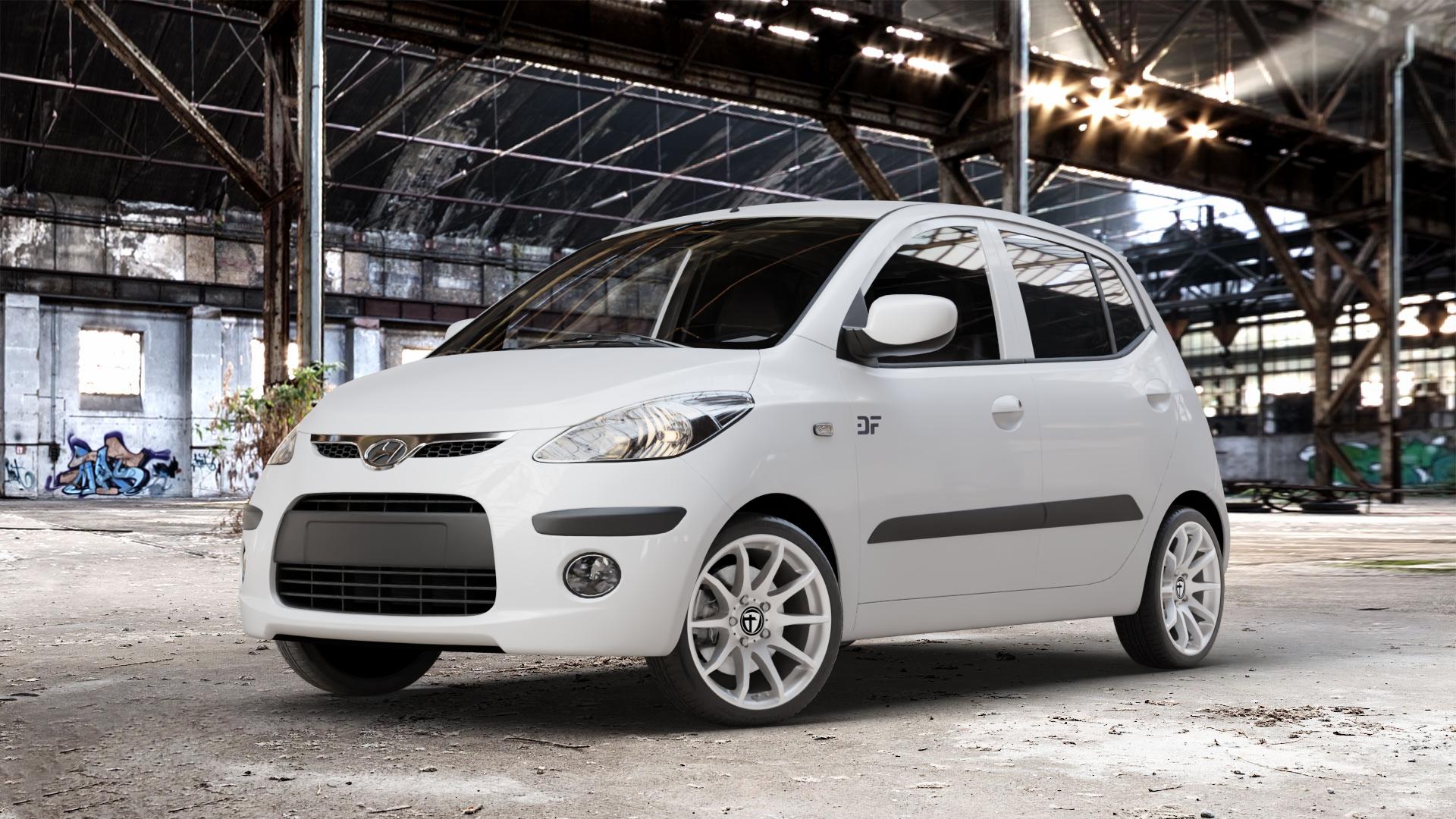 TOMASON TN1 bright silver Felge mit Reifen silber in 16Zoll Winterfelge Alufelge auf weissem Hyundai i10 Typ PA ⬇️ mit 15mm Tieferlegung ⬇️ Old Industrial Hall_max_4400mm_2024 Frontansicht_1