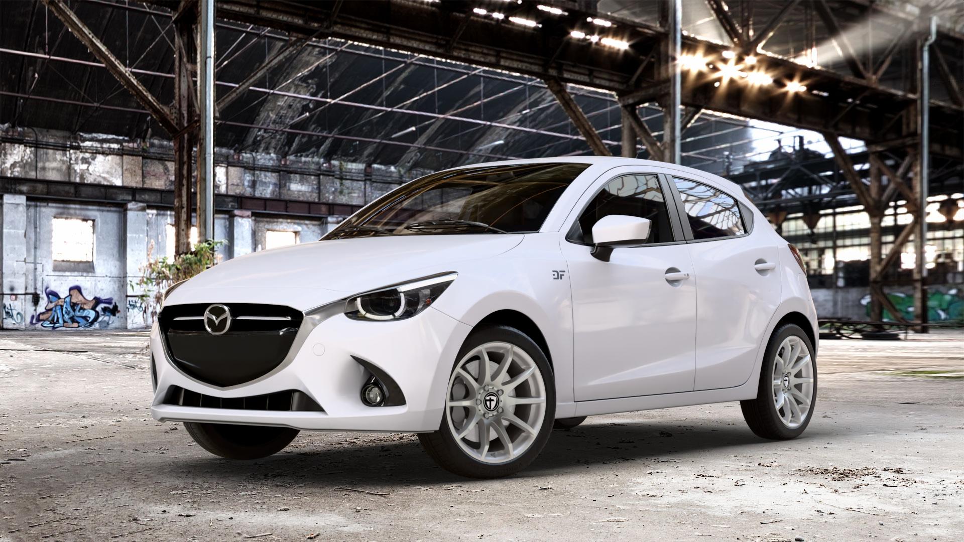 TOMASON TN1 bright silver Felge mit Reifen silber in 17Zoll Winterfelge Alufelge auf weissem Mazda 2 (15-) (DJ) 1,5l SKYACTIV-G 75 55kW (75 PS) 90 66kW (90 115 85kW (116 SKYACTIV-D 105 77kW (105 (20-) Facelift ⬇️ mit 15mm Tieferlegung ⬇️ Old Industrial Hall_max_4400mm_2024 Frontansicht_1