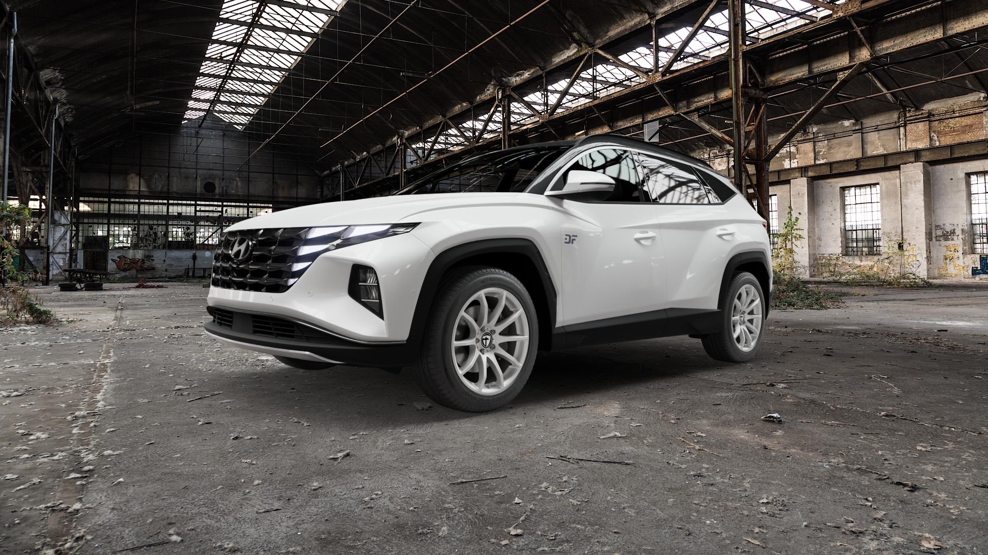 TOMASON TN1 bright silver Felge mit Reifen silber in 18Zoll Winterfelge Alufelge auf weissem Hyundai Tucson III Typ NX4e ⬇️ mit 15mm Tieferlegung ⬇️ Old Industrial Hall_max5000mm_2022 Frontansicht_1