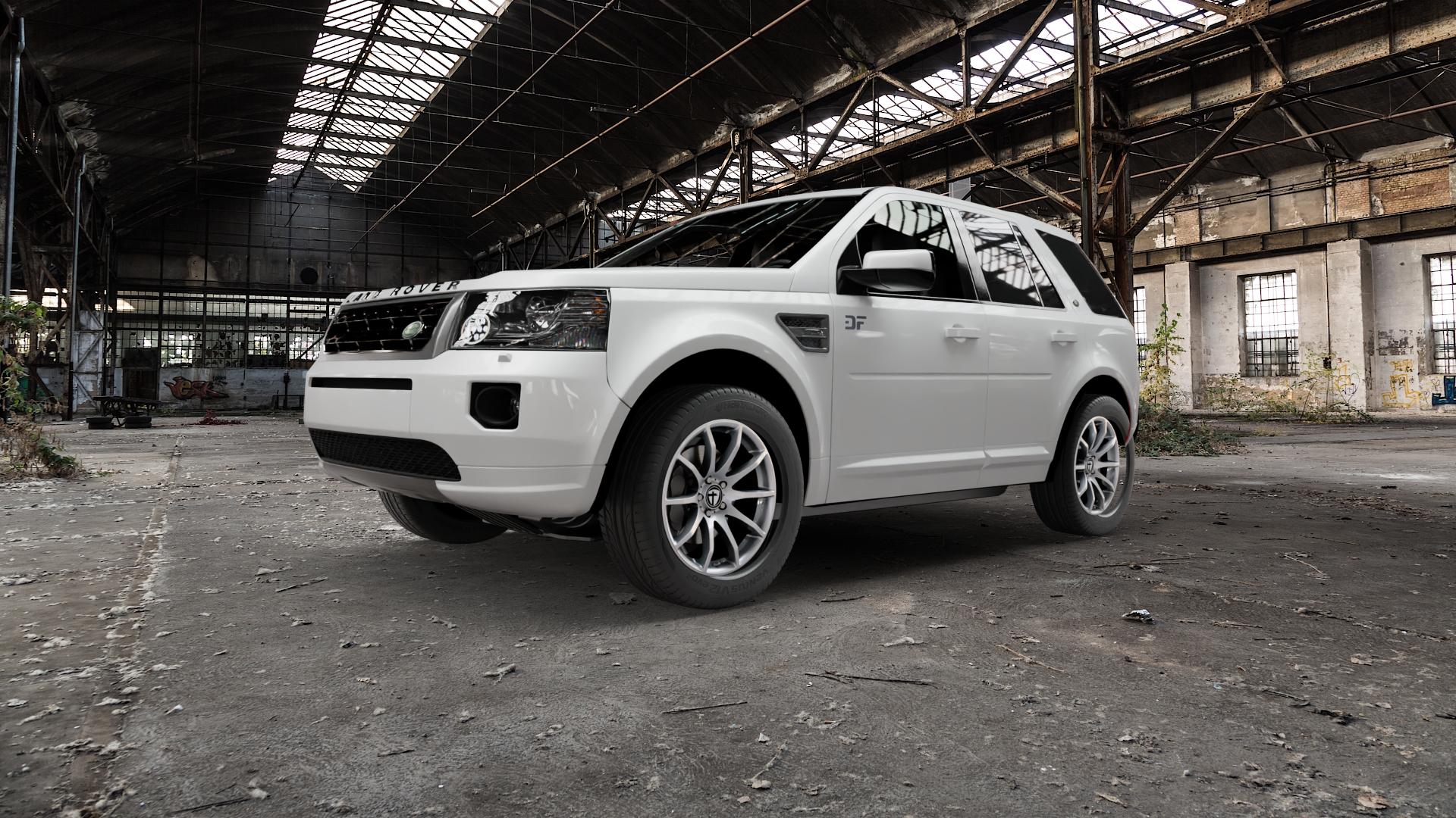 TOMASON TN1 bright silver Felge mit Reifen silber in 18Zoll Winterfelge Alufelge auf weissem Land Rover Freelander II Typ LF ⬇️ mit 15mm Tieferlegung ⬇️ Old Industrial Hall_max5000mm_2022 Frontansicht_1