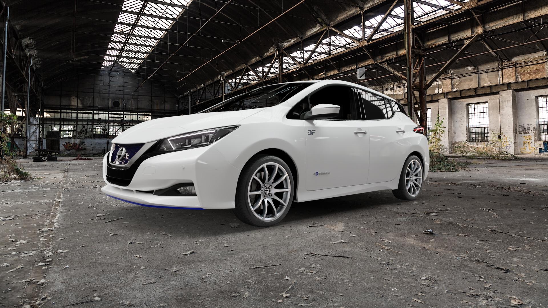 TOMASON TN1 bright silver Felge mit Reifen silber in 18Zoll Winterfelge Alufelge auf weissem Nissan Leaf Typ ZE1 ⬇️ mit 15mm Tieferlegung ⬇️ Old Industrial Hall_max5000mm_2022 Frontansicht_1